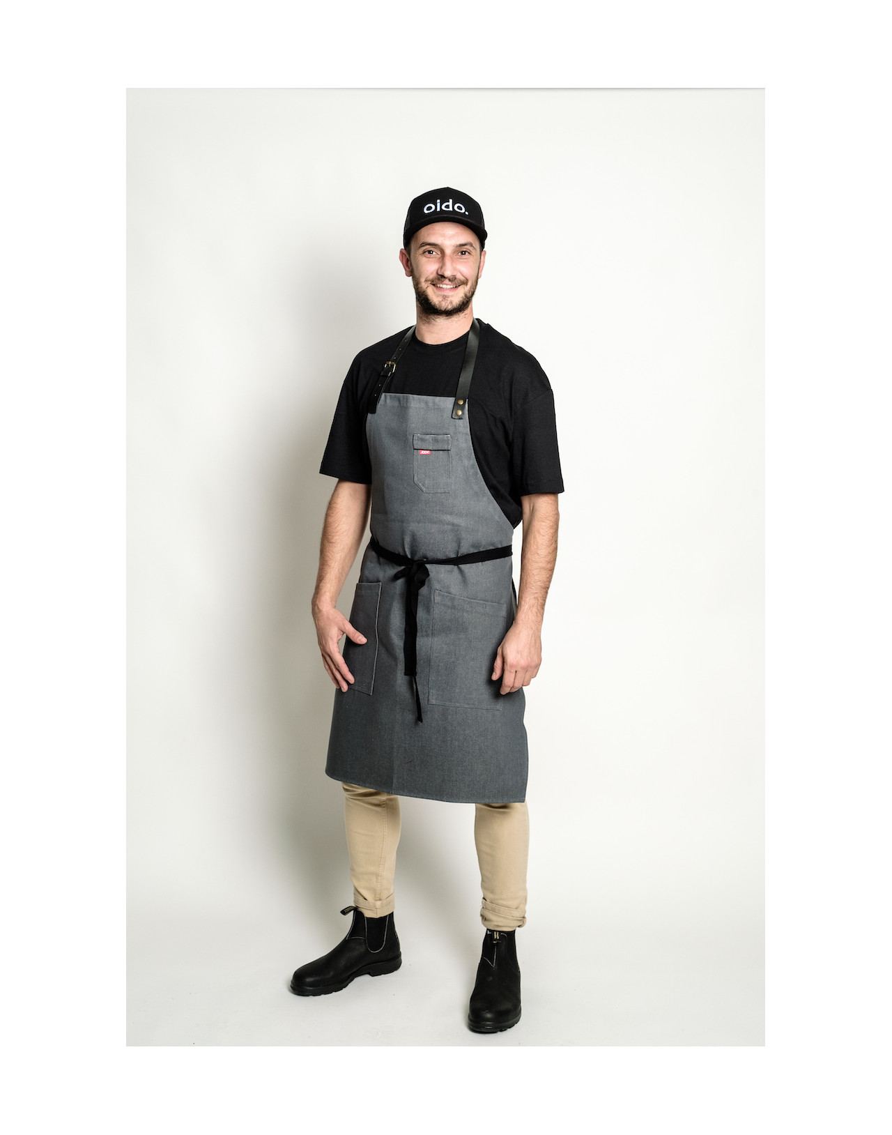 Waxed look denim apron with faux leather straps