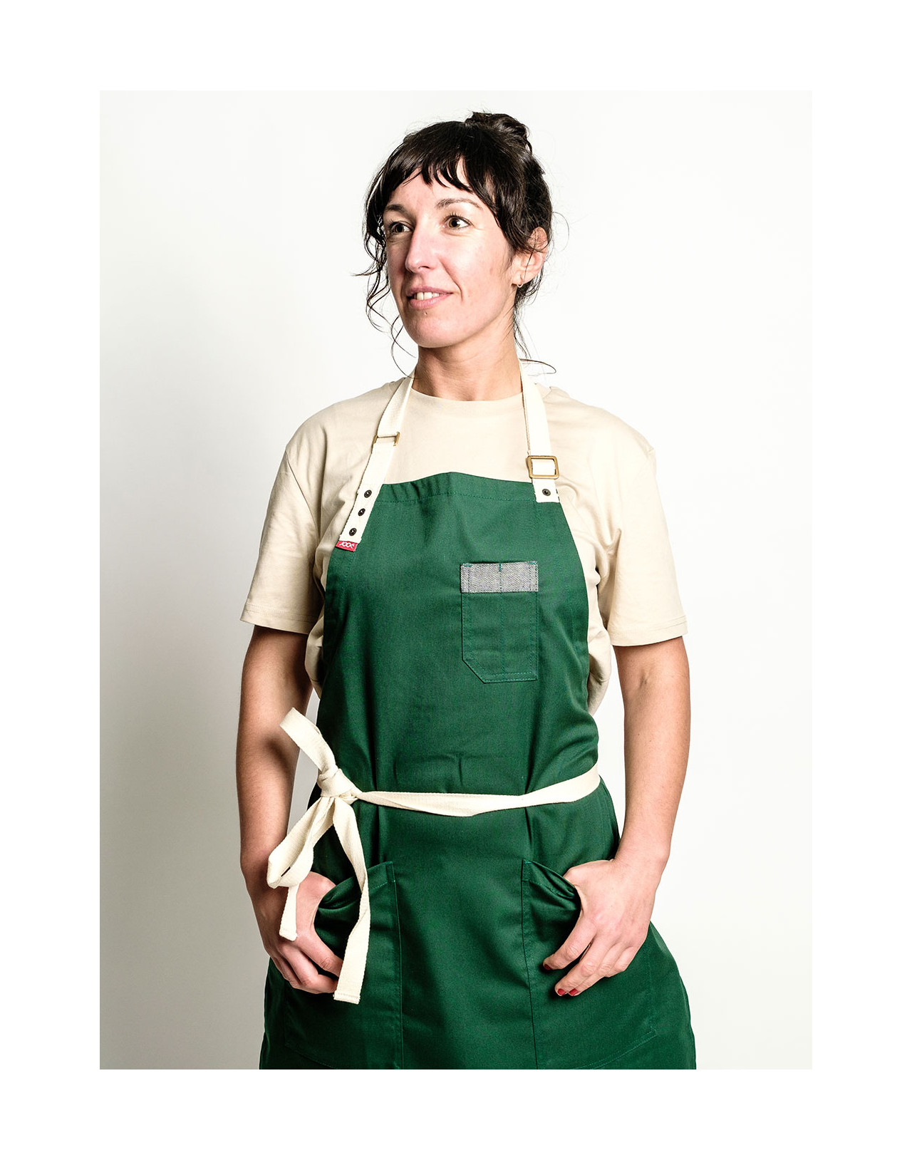 Green chef apron with white straps